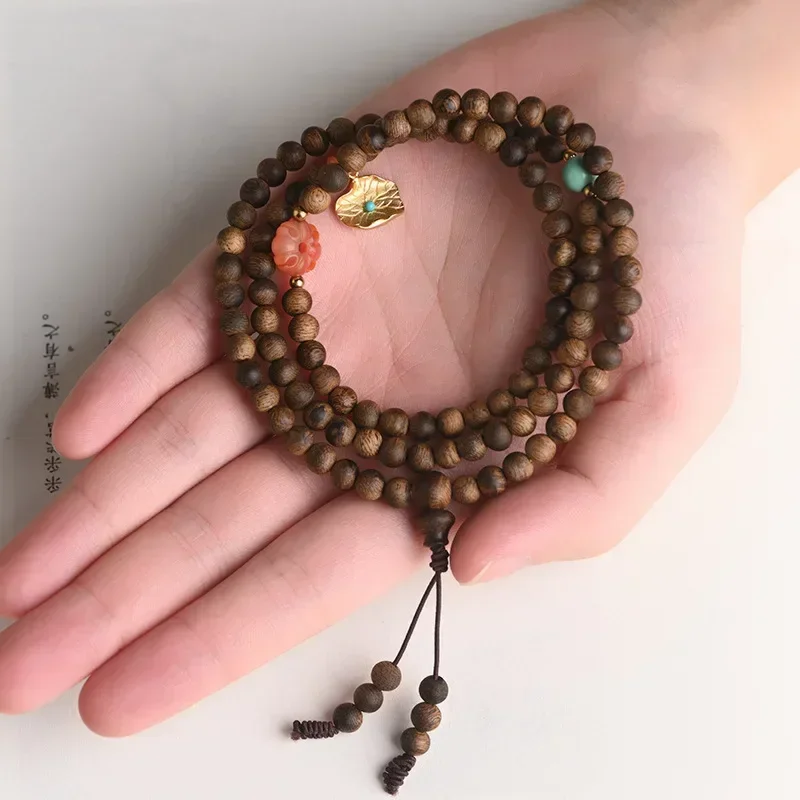 

Brunei Soft silk nine heavy old material agarwood hand string 108 calligraphy Buddha beads bracelet women's vintage bracelet