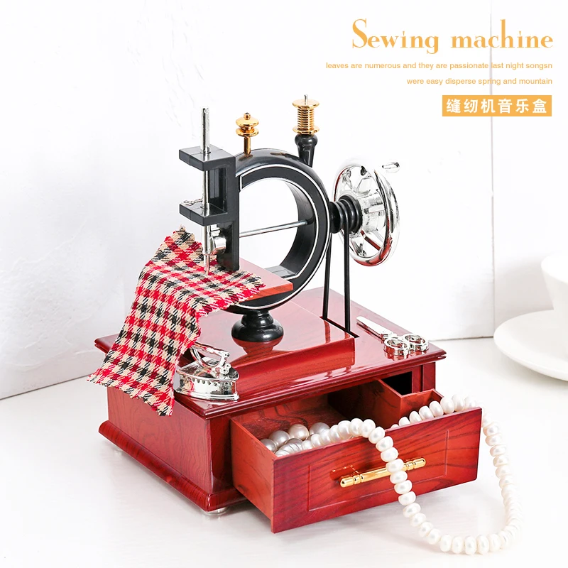 Retro, nostalgic, old-fashioned hand cranked sewing machine, antique model, music box, clothing store, bar, home decoration and