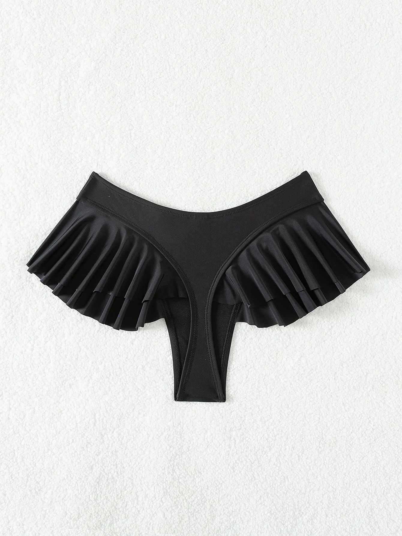 Low-slung thong with side ruffle-edge plain bikini