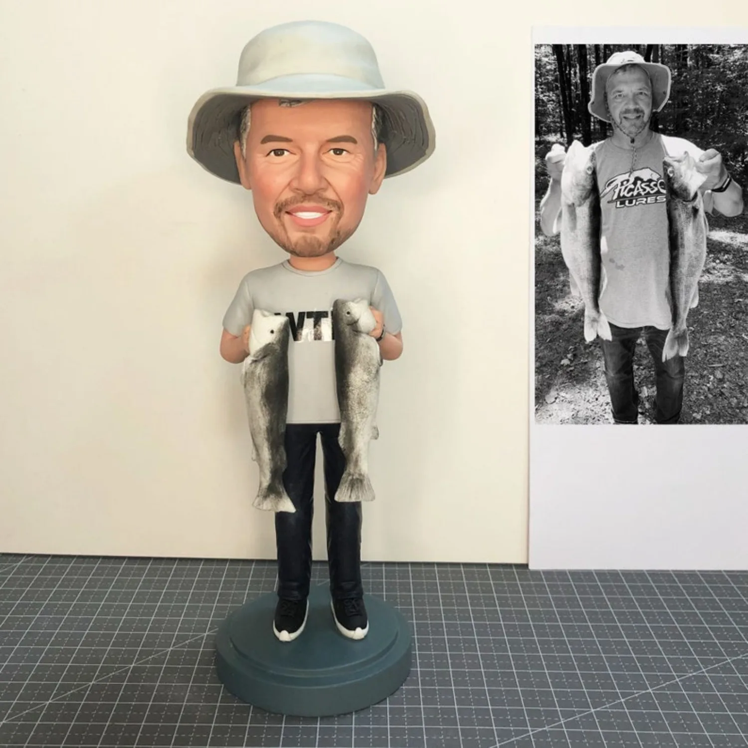 

Personalized Fisherman Bobblehead Holding Two Fish Handmade Full Body Clay Figurine Custom Gift For Dad Husband Angler