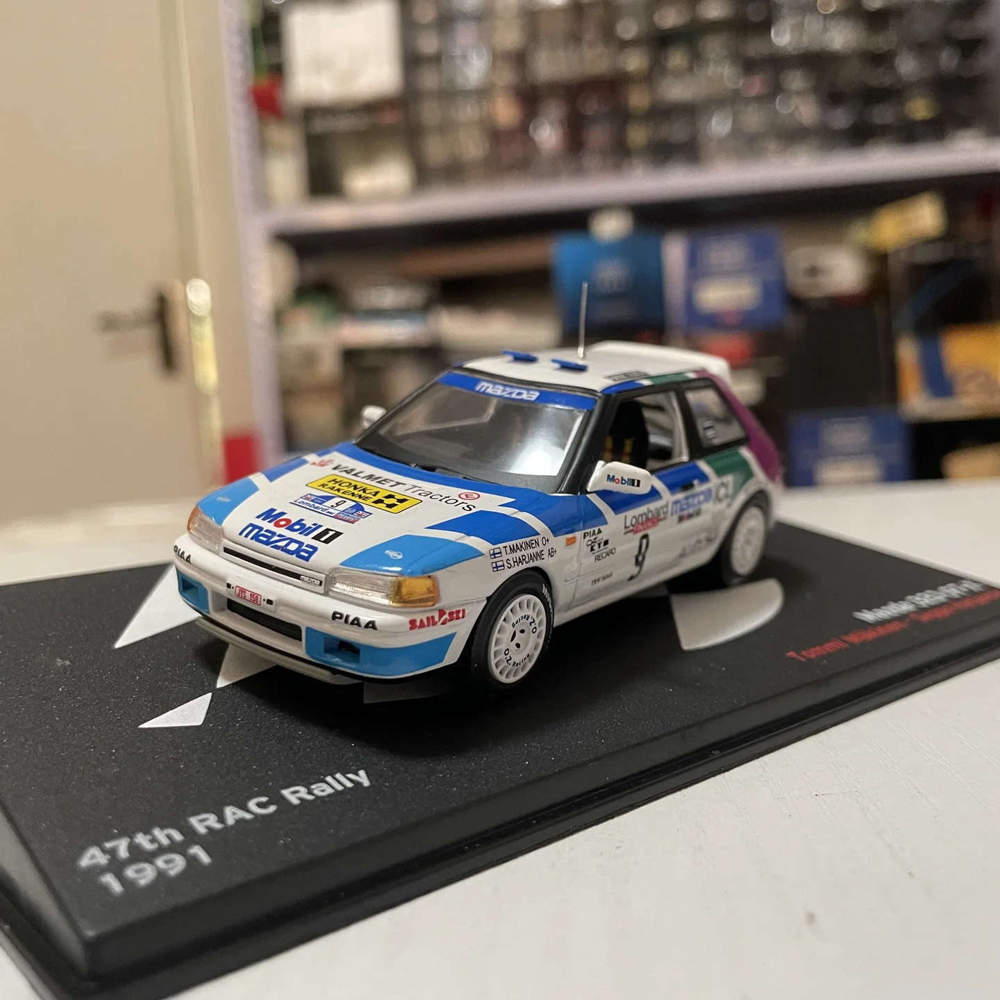 

IXO 1:43 Scale Diecast Alloy MAZDA 323 GT-X 1991 RAC WRC Toys Cars Model Classics Nostalgia Adult Gifts Souvenir Static Display