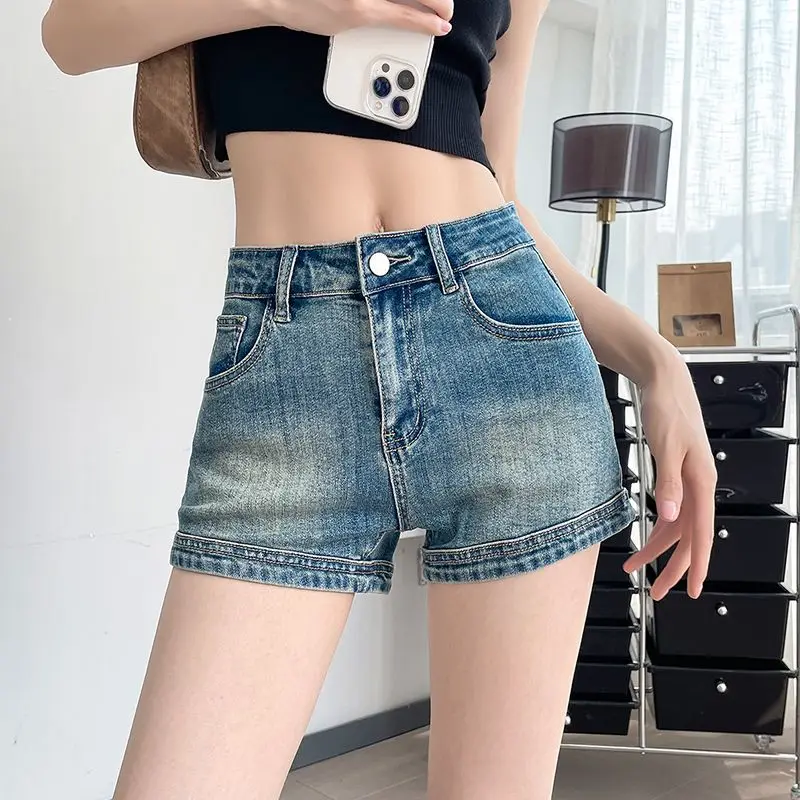 Nuovi pantaloncini di jeans da donna ultra corti a vita alta elasticizzati skinny a trapezio che allungano le gambe