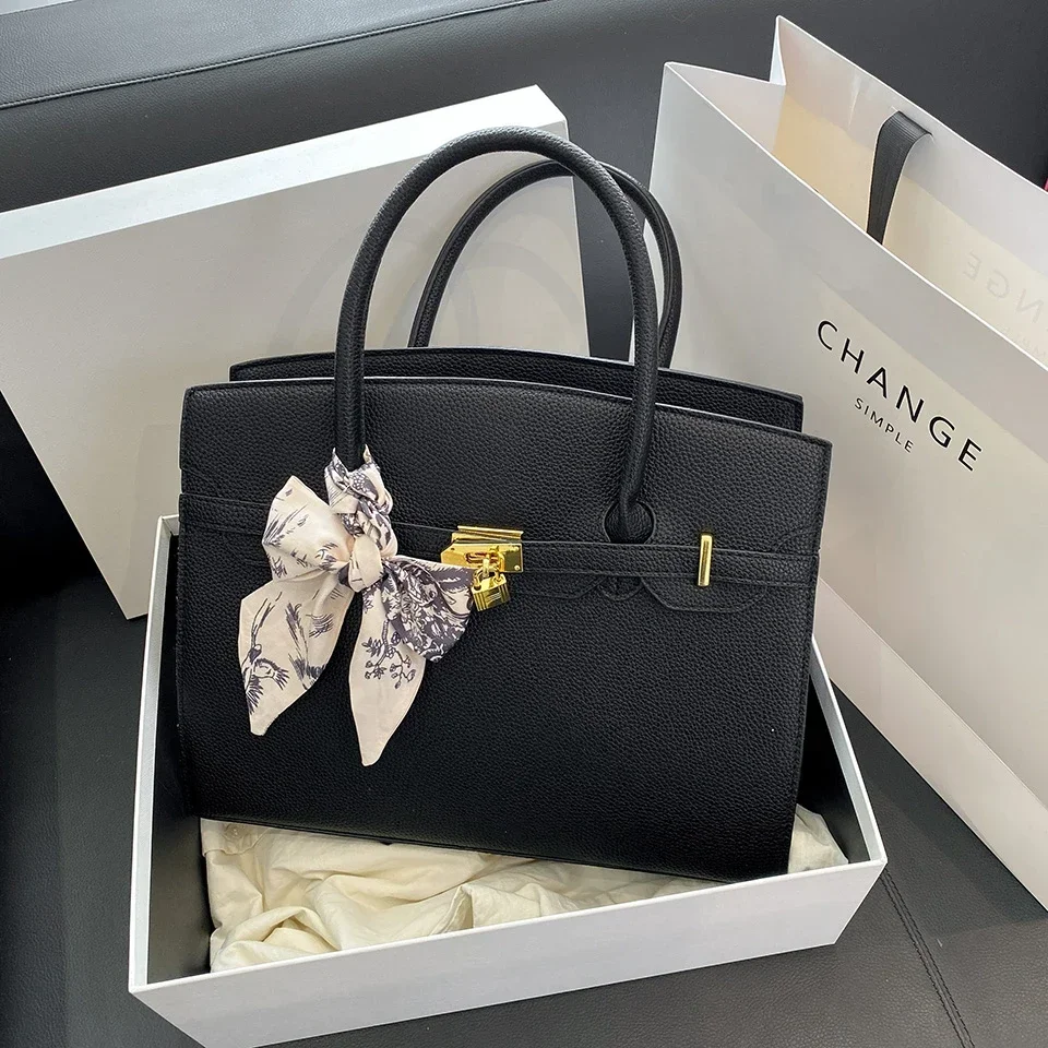 

Minimalist Fashionable Trendy Clutch Handbag Featuring Letter Logo and Simple Vintage Style for Ladies