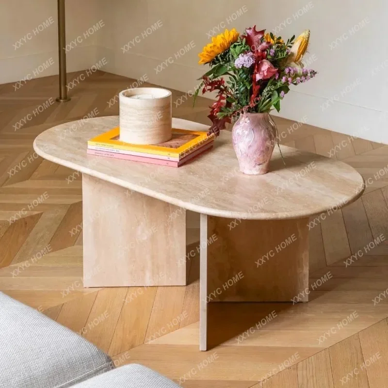

A Nordic wabi sandy wind natural travertine coffee table oval modern simple marble tea table