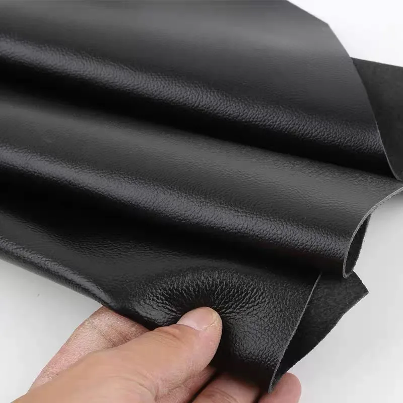 Black top layer fine grain cowhide leather material, real leather lychee pattern soft cowhide sofa, car seat headboard soft bag