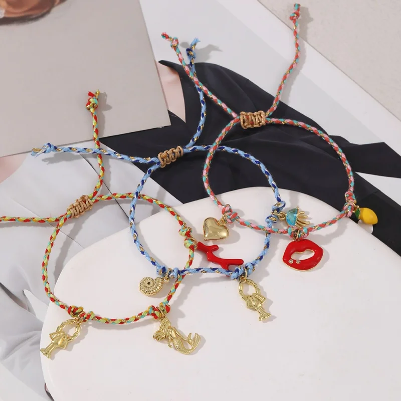 Braided Cord Bracelet Featuring a Copper Charm With Cubic Zirconia and Enamel Detailing—Designs Include Lips, Hearts, Mermaids,