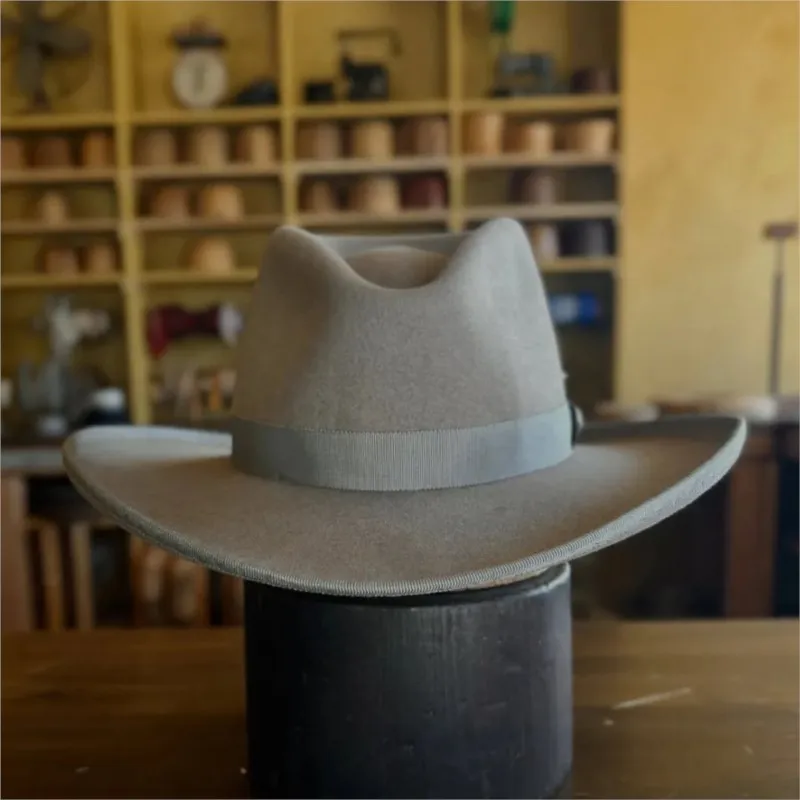 A fashionable felt wide-brimmed top hat