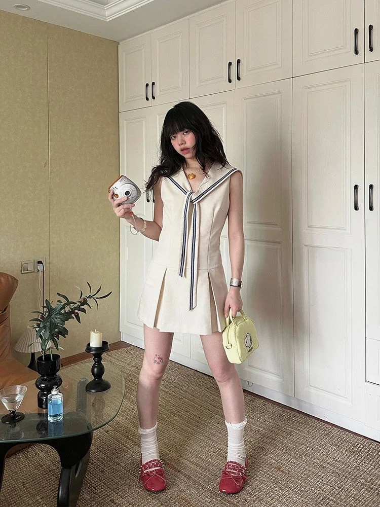 

Бесплатное оптималистское темно-синее платье с воротником и завязкой на талии, женское летнее новое платье без рукавов для поездок на работу и ветер