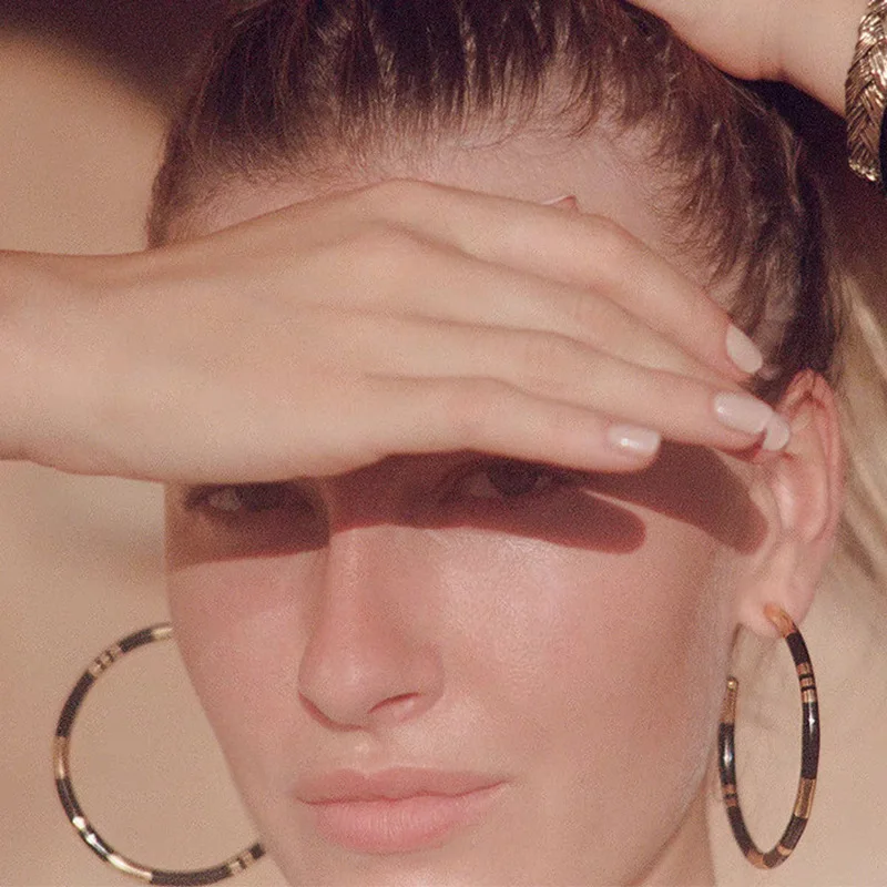 French niche-design new‑style fashionable black, white, and gold enamel copper‑gilded hoop earrings, large size.CWholesale hoop