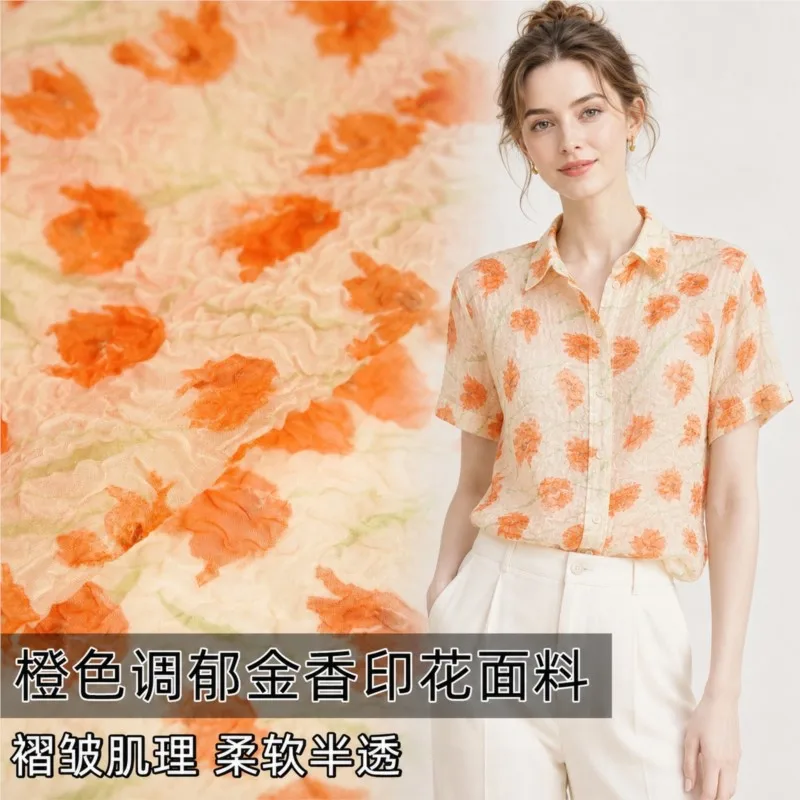 Semi-transparent orange-toned gold printed pleated fabric for dress shirt and cheongsam designer