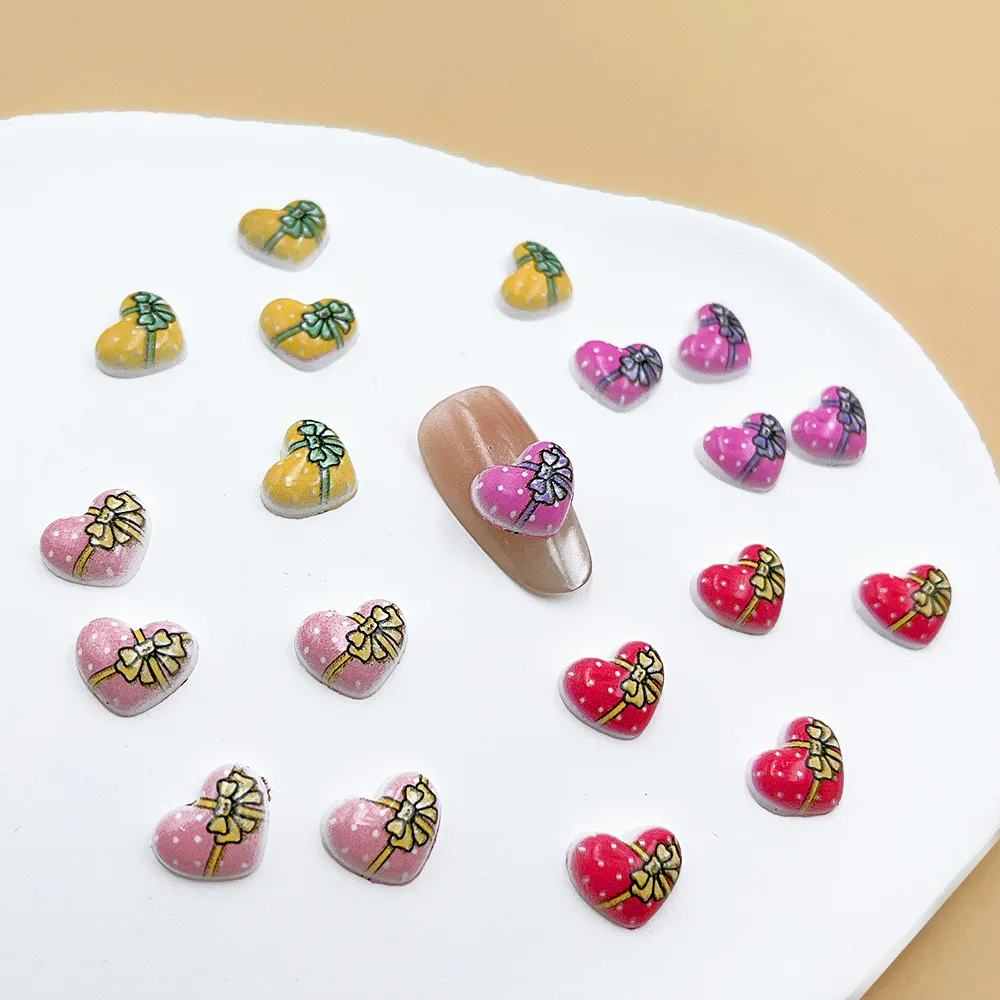 100 unids/pack 9 × 11mm caja de regalo de corazón dijes de resina para uñas-arte de uñas con lazo 3D, bonita decoración de uñas a presión para manicura romántica DIY