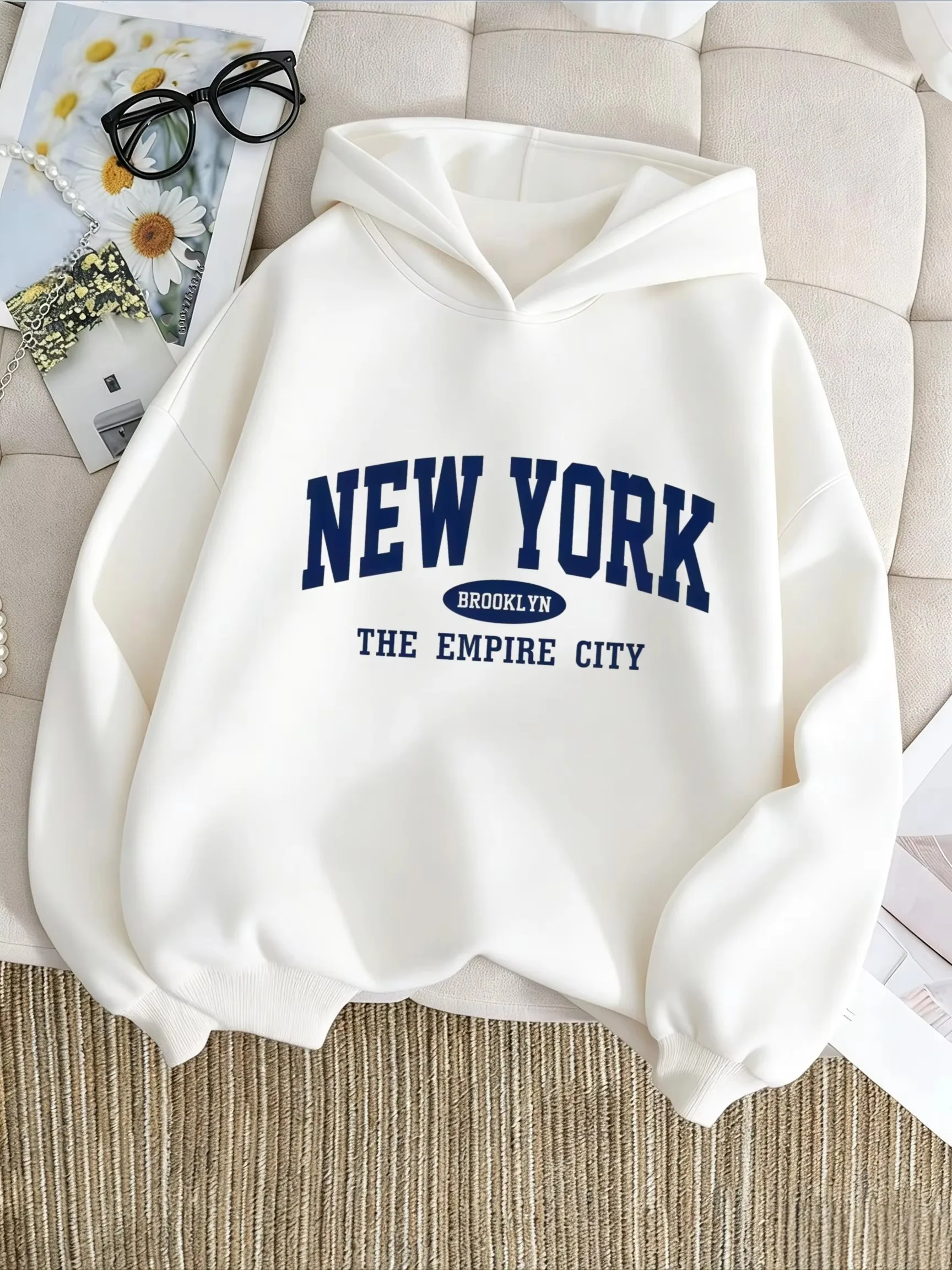 American-style college style. NEW YORK - Brooklyn, NY. Dark blue letter-printed children's hooded sweatshirt.