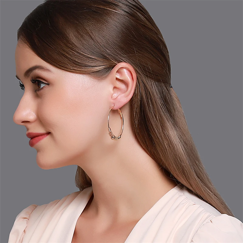 2026 New Light luxury Silver Plated Twining Simulated Beads Simple Glossy Geometry Hollow Alloy Piercing Hoop Earrings for Women