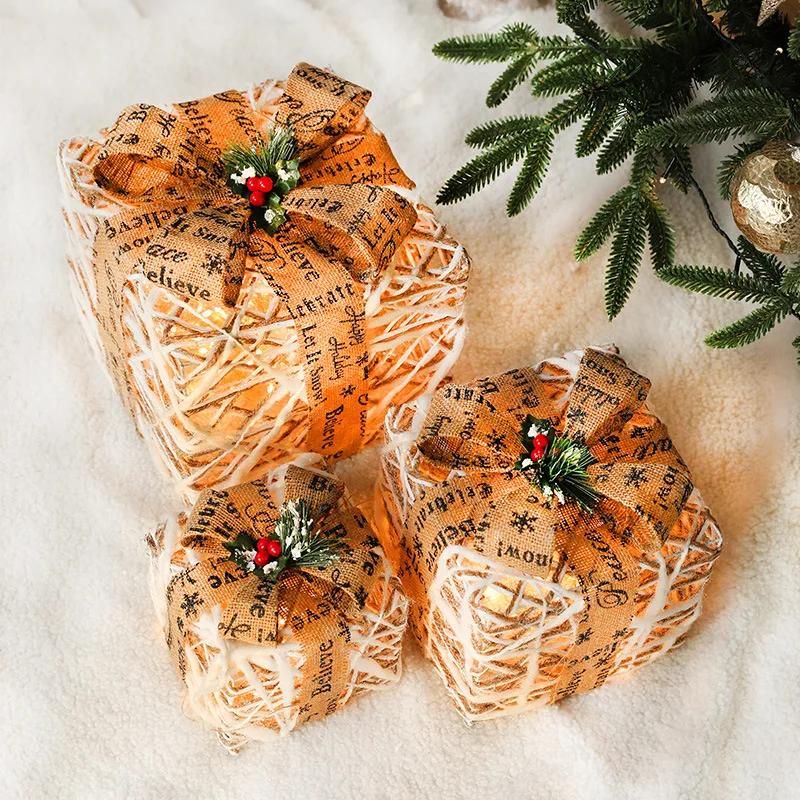 Christmas with lights, red and black lattice sticky gift box, empty box, pine cone decorative ornament scene arrangement, three-