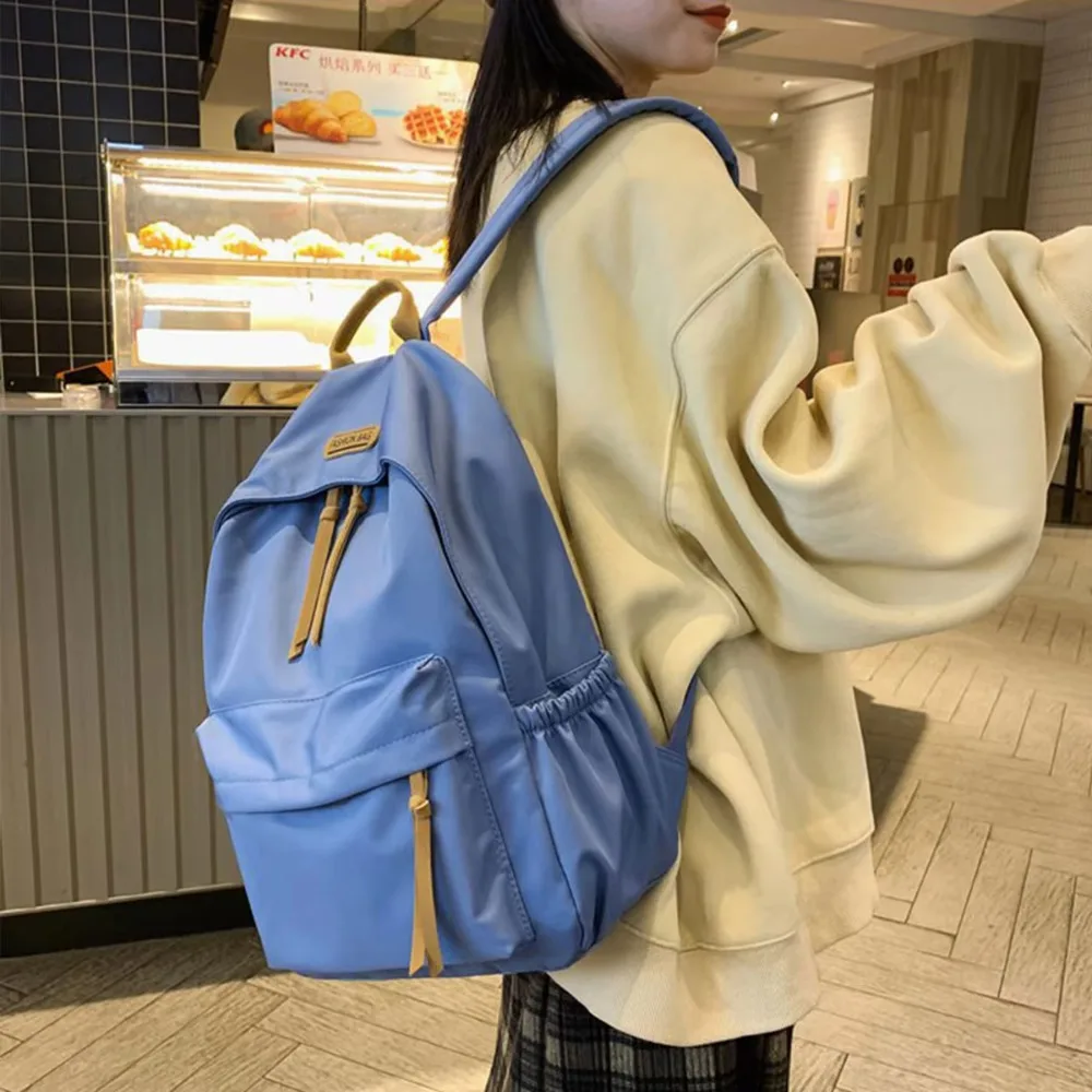 Mochila escolar duradera de Color sólido, bolso de nailon de gran capacidad a la moda, mochila ligera informal para estudiantes, uso diario