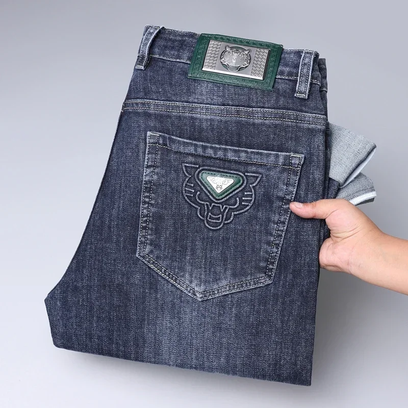 2024 Pantaloni lunghi elasticizzati larghi casual da uomo d'affari di marca di moda Four Seasons