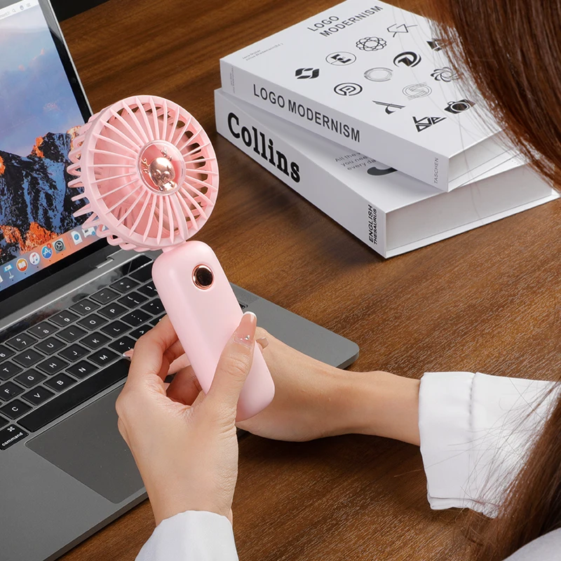 الجملة 1200 مللي أمبير مروحة صغيرة محمولة وحامل الهاتف الذكي قاعدة طاولة قائمة تعمل بالبطارية للاستخدام المنزلي للسيارة والمنزلية