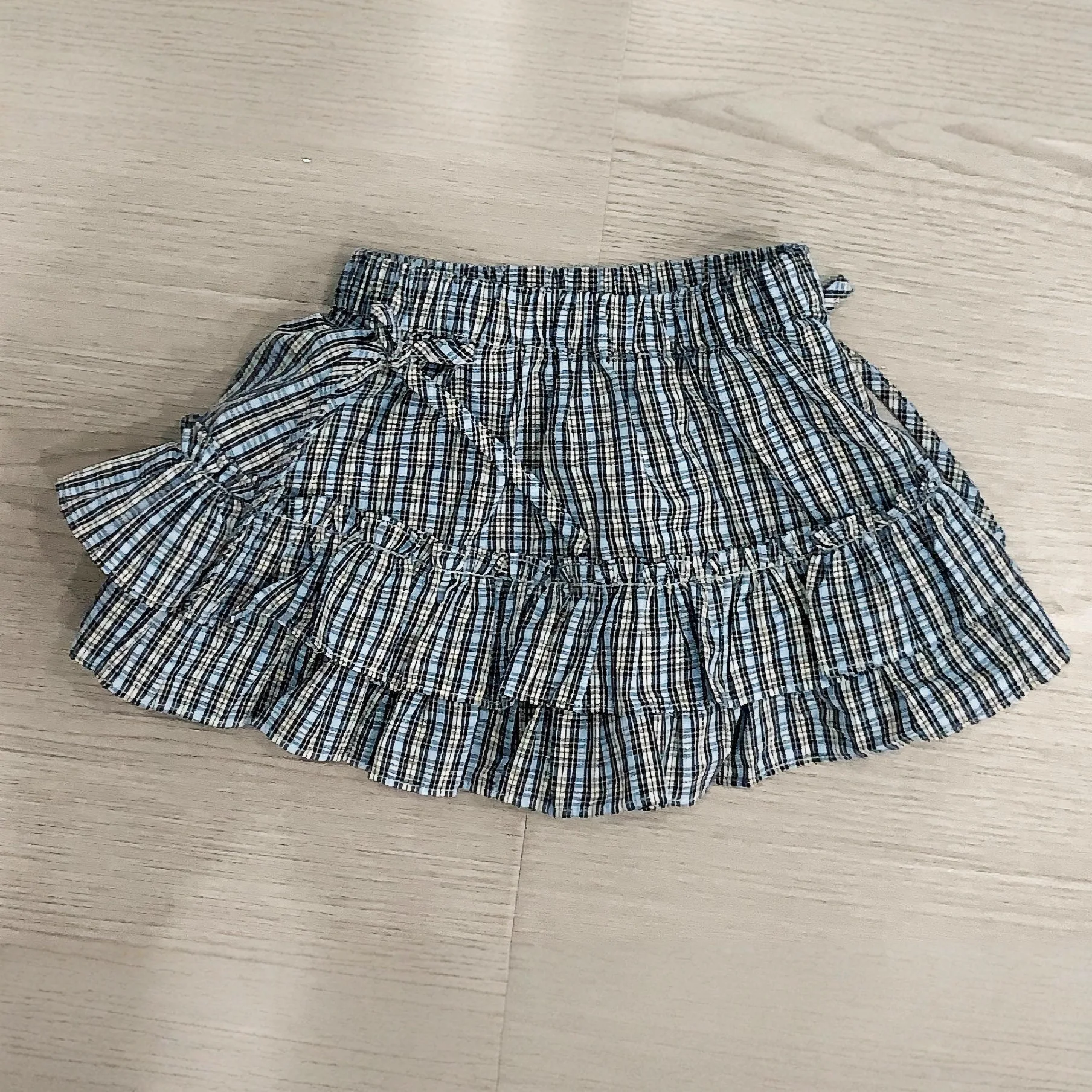 Korean Edition Bow Tie Bag Hip Fold Skirt Checkered Butt Curtain Stacked Short Skirt Minimalist Style 2025 New Fashion Girls'