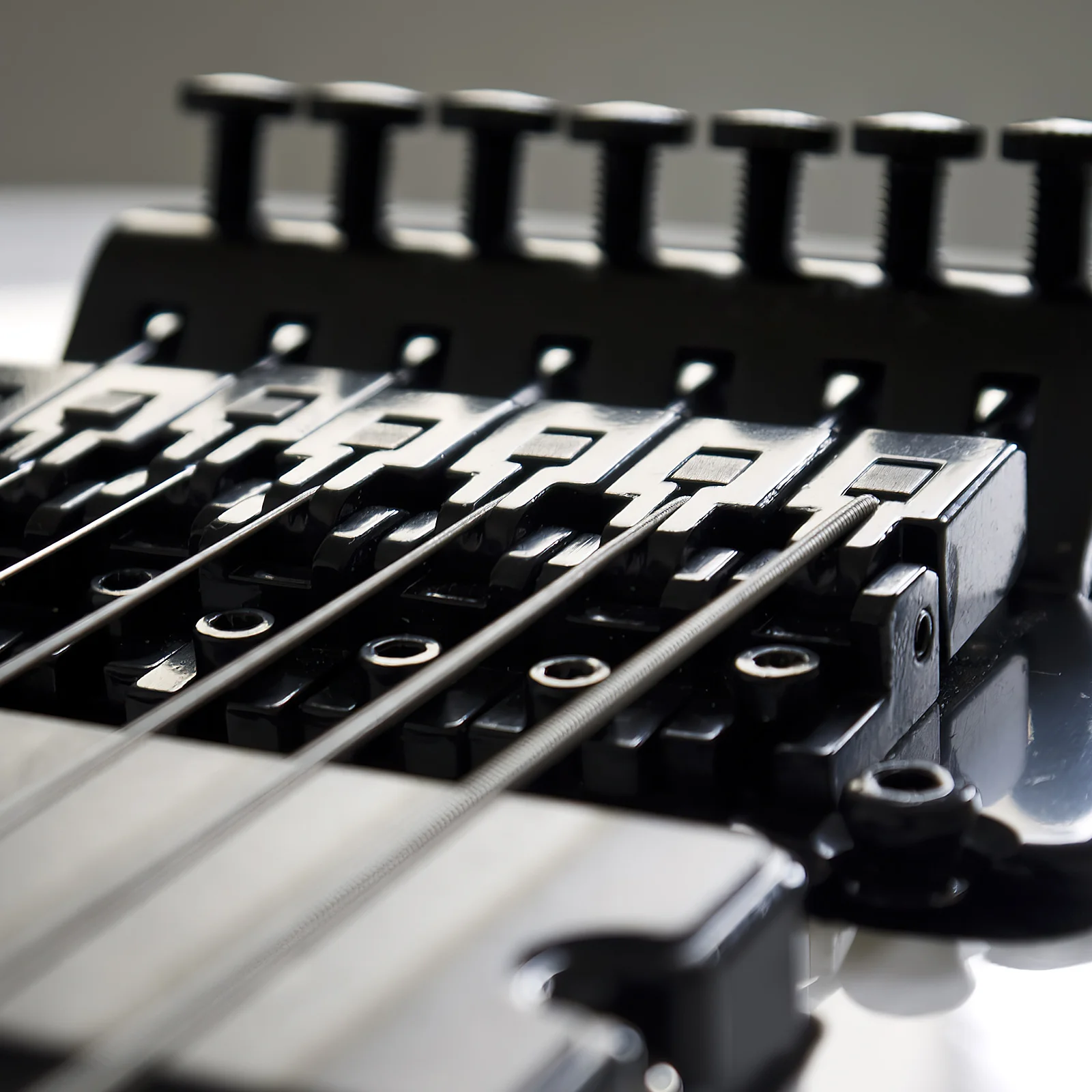 

Double Locking Bridge Saddles for Guitar Tremolo System Strong Metal Construction Stable Tuning Performance Smooth Rollers