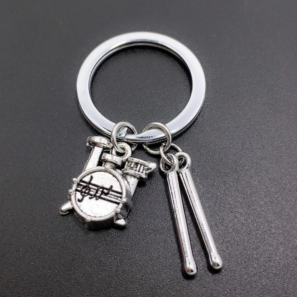 1 llavero de juego de batería para entusiastas de la música, llavero de aleación de zinc estilo punk, colgante de bolso de banda de rock
