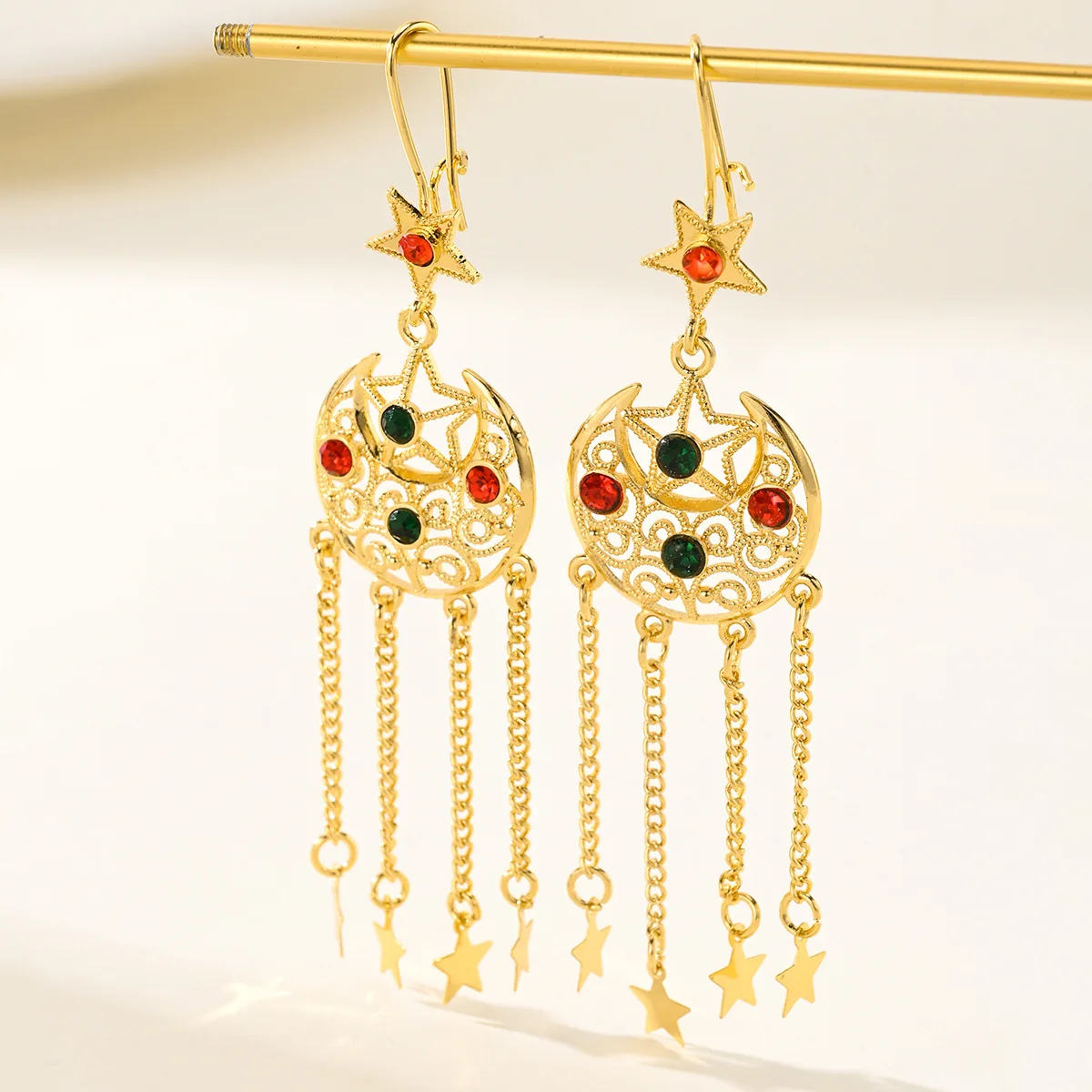9999 gold Bohemian long-style star and moon fringed earrings for global travel, featuring scenes from Xinjiang and ethnic style