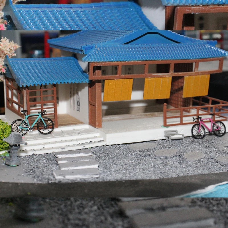 Model roweru w skali 1:64, rower szosowy, model roweru publicznego, model stojaka na rowery.