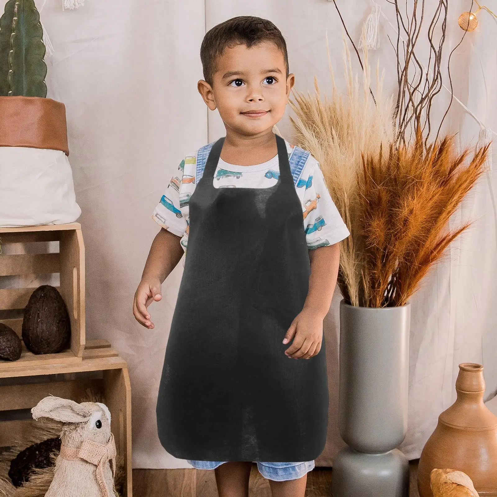 ผ้ากันเปื้อน Unisex ทิ้งไม่ทอหนาผู้หญิง Overalls สําหรับทําอาหารเสื้อผ้าทํางานผ้ากันเปื้อนสีดํา