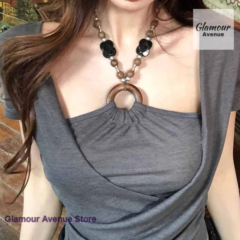 

French pure desire spice girl wind fake two-piece shoulder short-sleeved women's summer waist slimming design casual Joker top