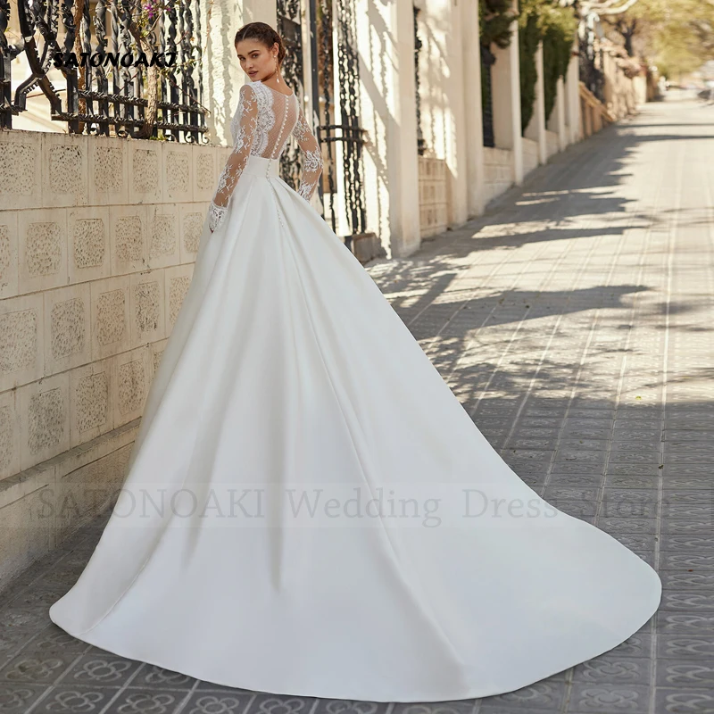 Abito da sposa elegante personalizzato in pizzo di raso Boho con tasche per le donne Manica lunga con scollo a V Sposa Abiti da sposa Robe Mariée