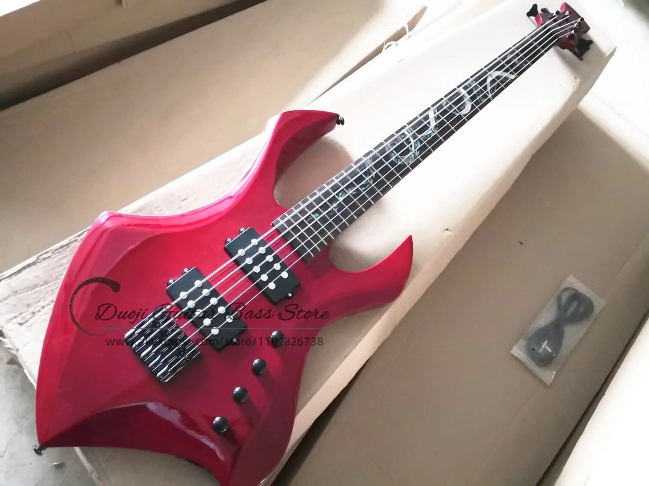 Trans red bass, 5-string bass guitar, maple neck Set In body, rosewood fingerboard colored snake inlay, black bridge