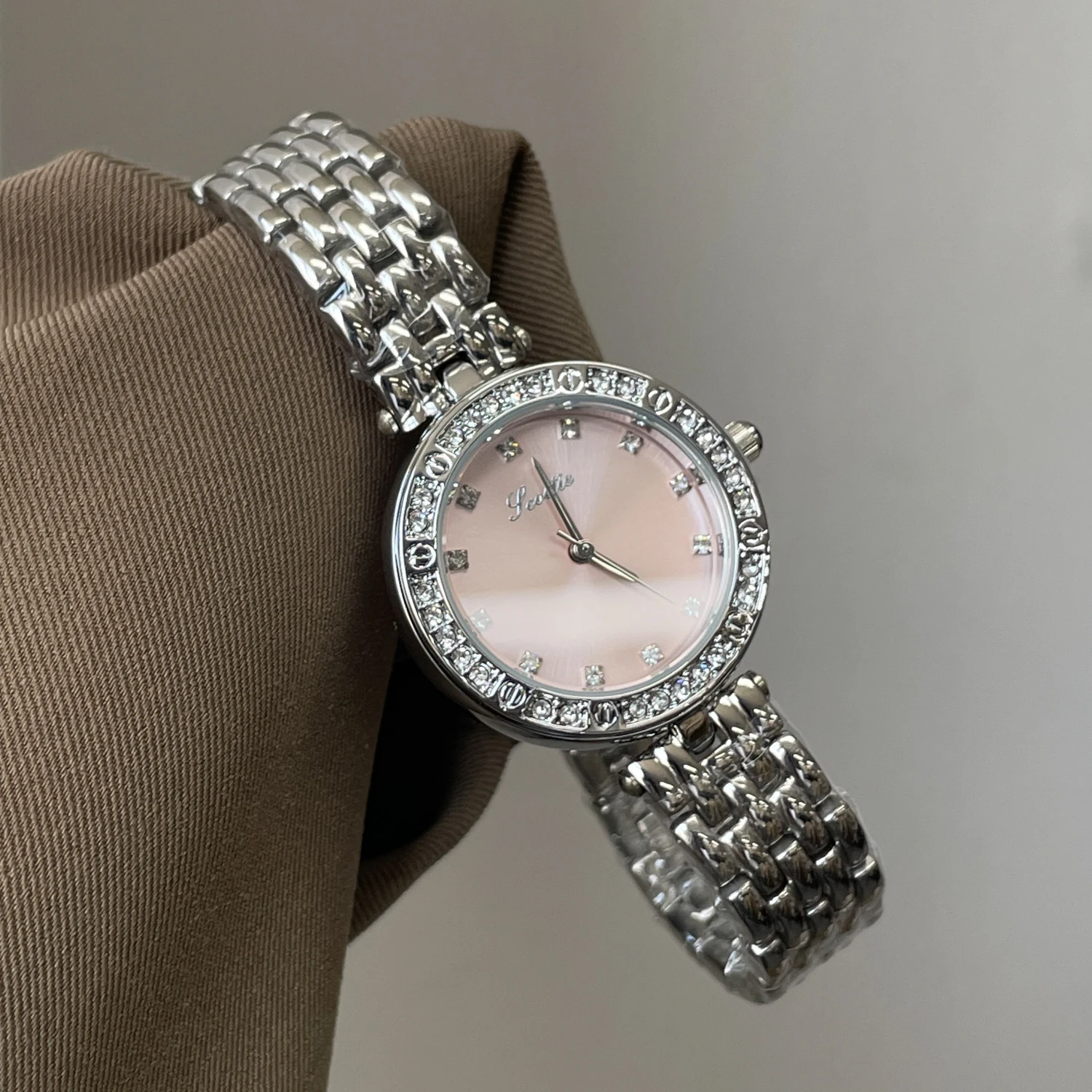 Elegant women's wristwatch understated luxury, high-end design, artistic women's watch, sophisticated and stylish women's watch.