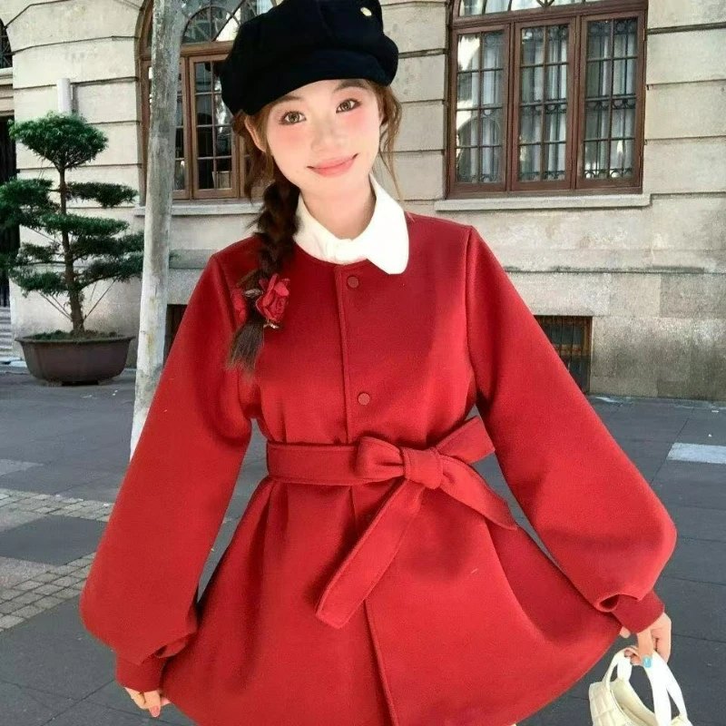 Cappotto di lana girocollo da donna 2026 Autunno/Inverno Nuovo stile Manica a lanterna Giacca calda di lana con lacci in vita per le donne