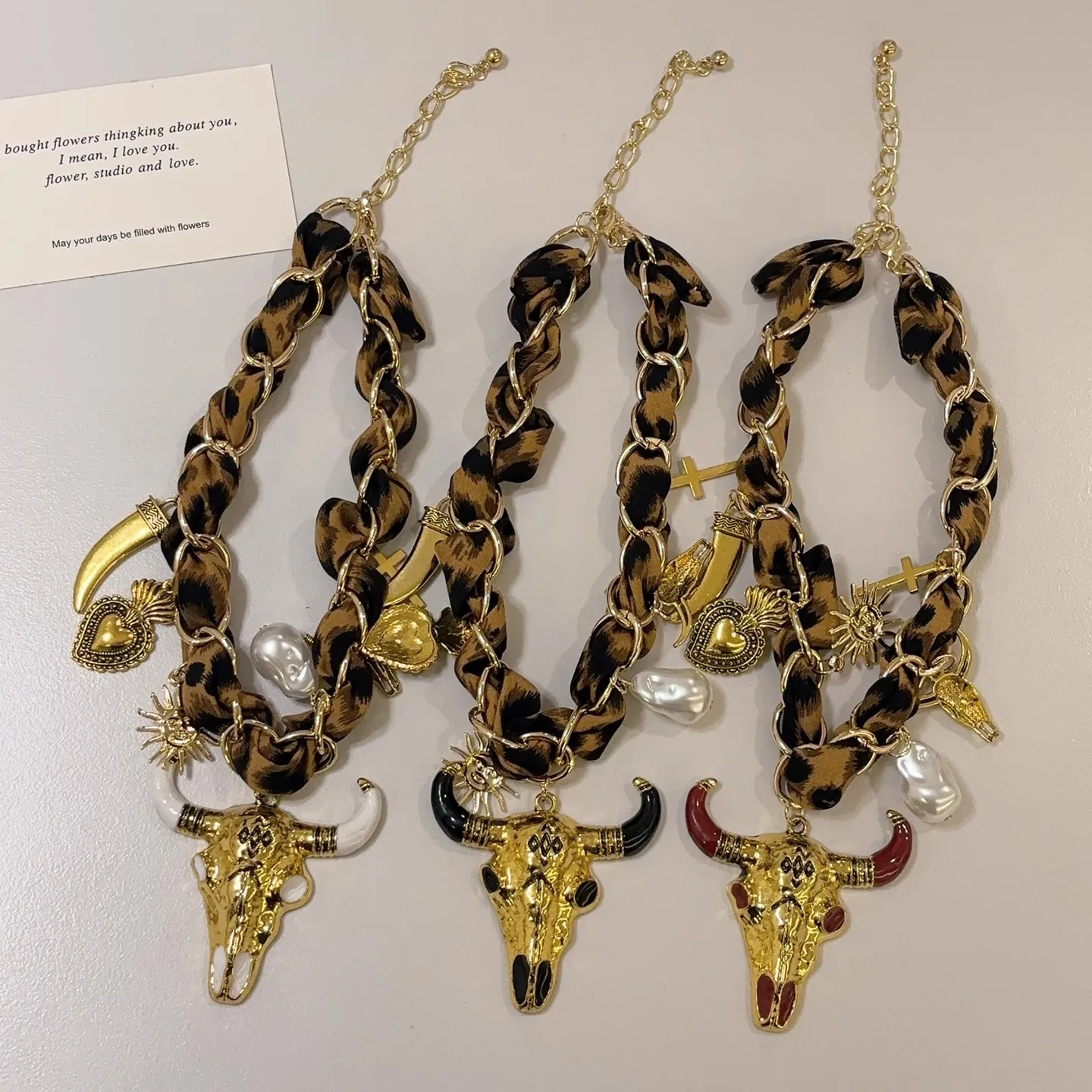 European and American exaggerated design vintage silk scarf with a bull head pendant necklace, for travel and vacation jewelry.