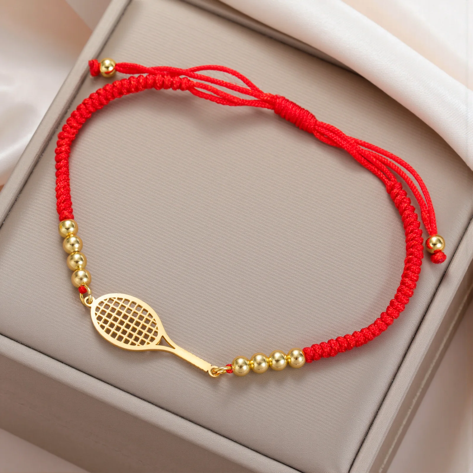 New trendy, simple titanium steel cut-out hollow racket double-hole pendant bracelet in black, adjustable woven string accessory