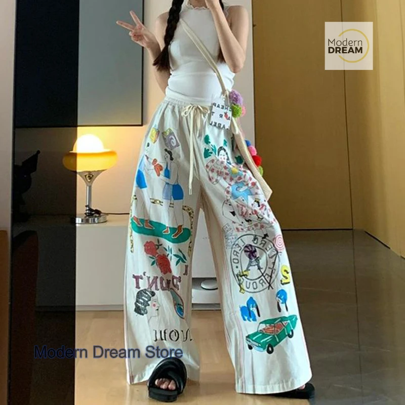

Korean version of simple minority cartoon graffiti printed pants women's summer new plus size design high waist casual pants.