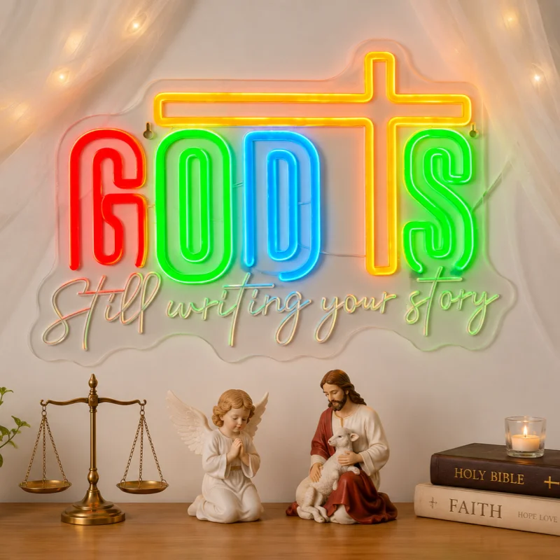 A neon sign reading “God is writing your story,” perfect as wall decor for bedrooms, home offices, or parties