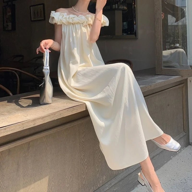 

Suspender dress summer loose temperament vacation off the shoulder and thin retro new word design dress