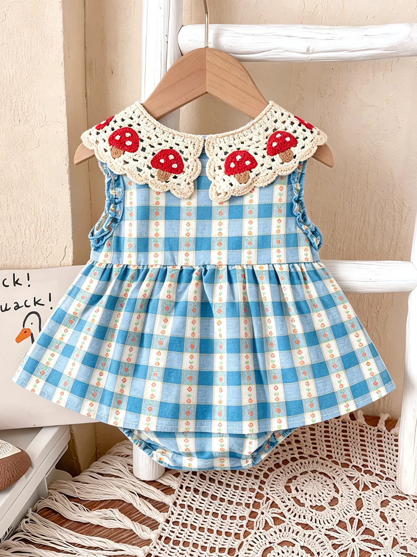Crocheted Blue-and-White Checkered Sleeveless Rompers with Mushroom Collar and Bow for Baby Girls—Spring/Summer Style