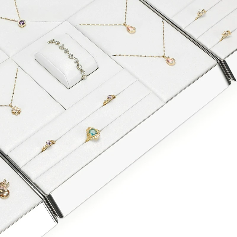 Jewelry counter props display white PU leather necklace, ring, earring, shiny metal frame jewelry plate
