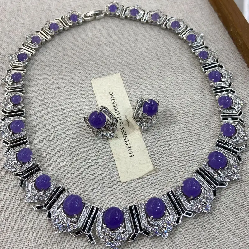 MedievalvintageExquisite, long, sweeping-shoulder-style earrings with purple gemstones and diamond accents, creating a luxurious