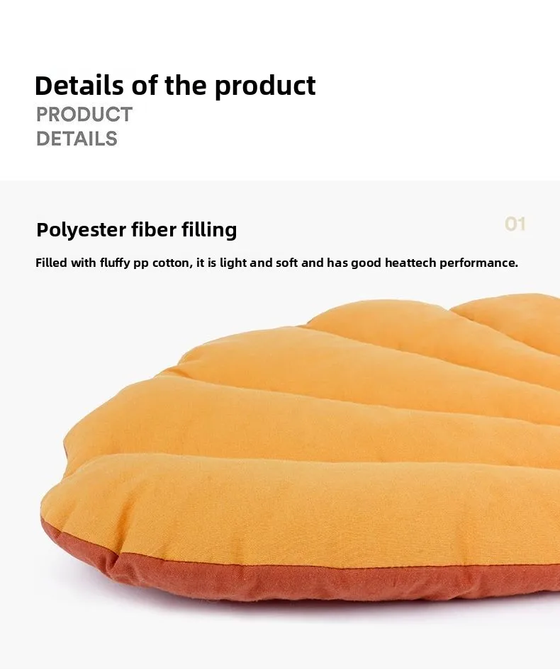 KittyNook Cat Co. Leaf Pattern Cat Sleeping Mat, a leaf-shaped washable bed with orange padding and a brown underside.