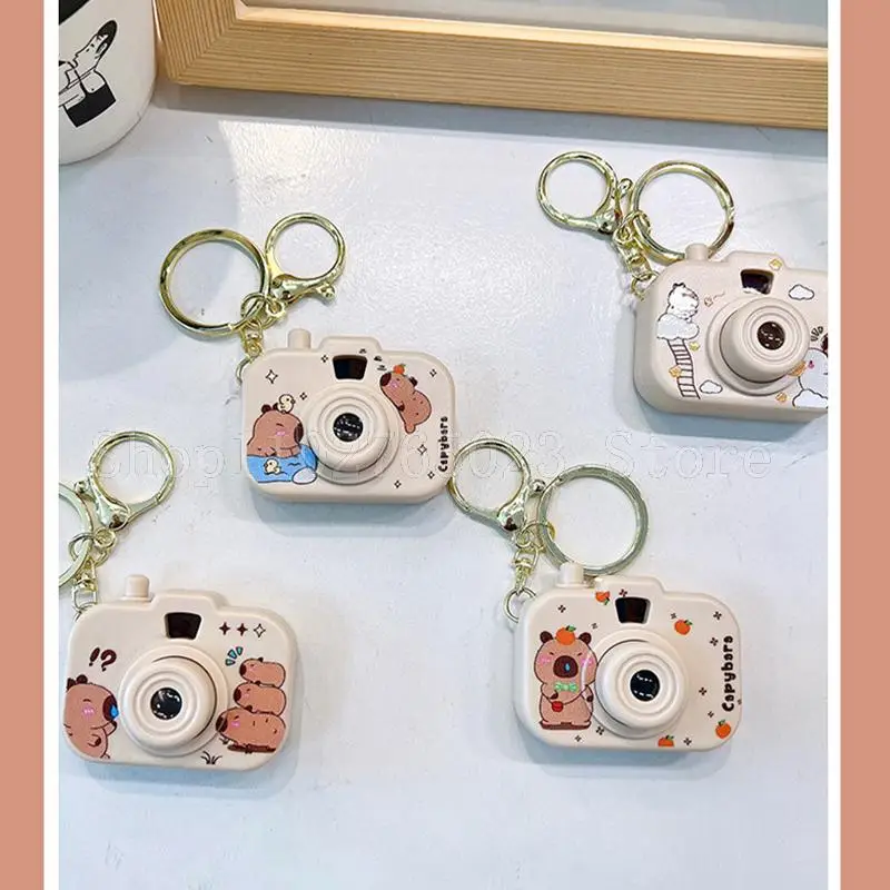 4pcs kawaii MINISO capibara telecamera di proiezione portachiavi zaino ciondolo decorazione personalità della moda regalo festival dei cartoni animati