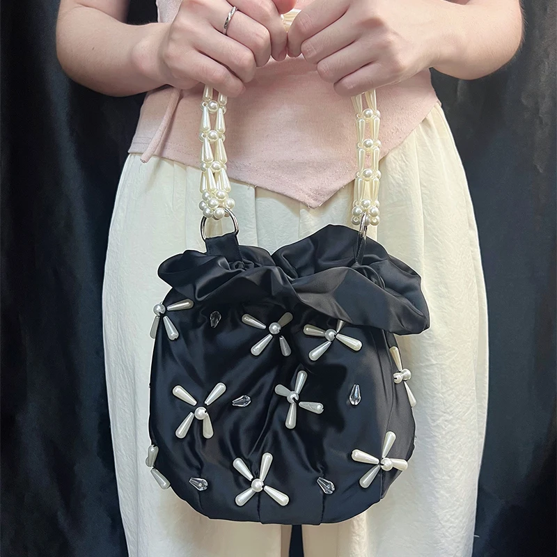 Bolso tipo cubo tejido a mano de verano de nicho de estilo europeo y americano, novedad de verano, bolso de cena moderno y personalizado