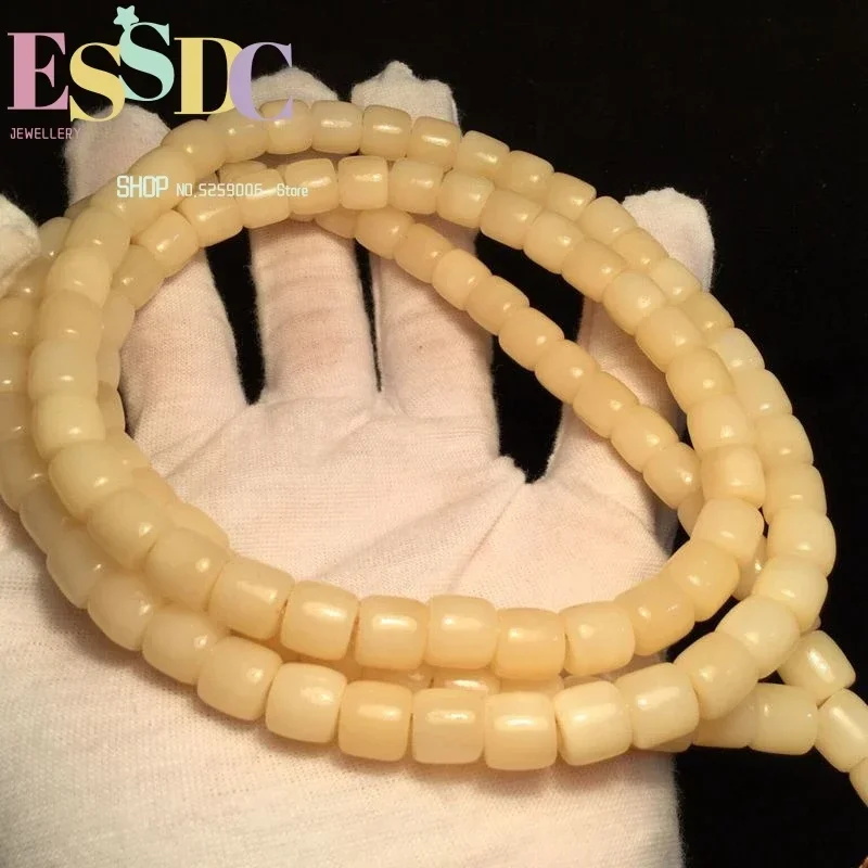Pulsera de cuentas budistas tibetanas de color primario Amarillo Aceite de Pollo y Camel, Barril 108, con diseño de escritura 'Bone Script' con efecto de aceite