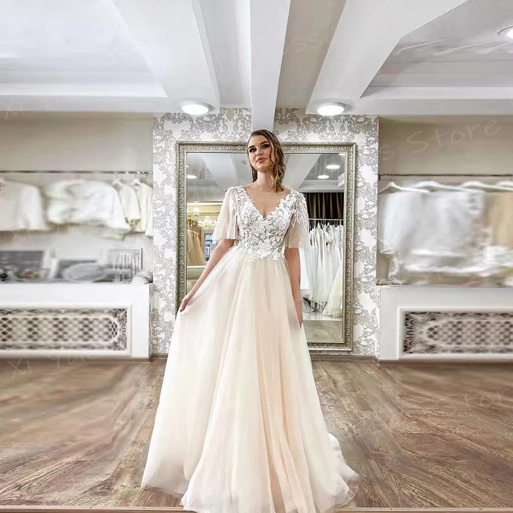 2025 Romantico A Line Abiti da sposa per le donne Appliques in pizzo Abiti da sposa Affascinante scollo a V manica corta Tulle Vestido De Novia