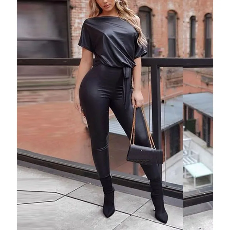 

Черные комбинезоны Krisnanas из искусственной кожи для женщин, уличная одежда 2025 года, кожаные леггинсы на одно плечо, цельный комбинезон с поясом 106585