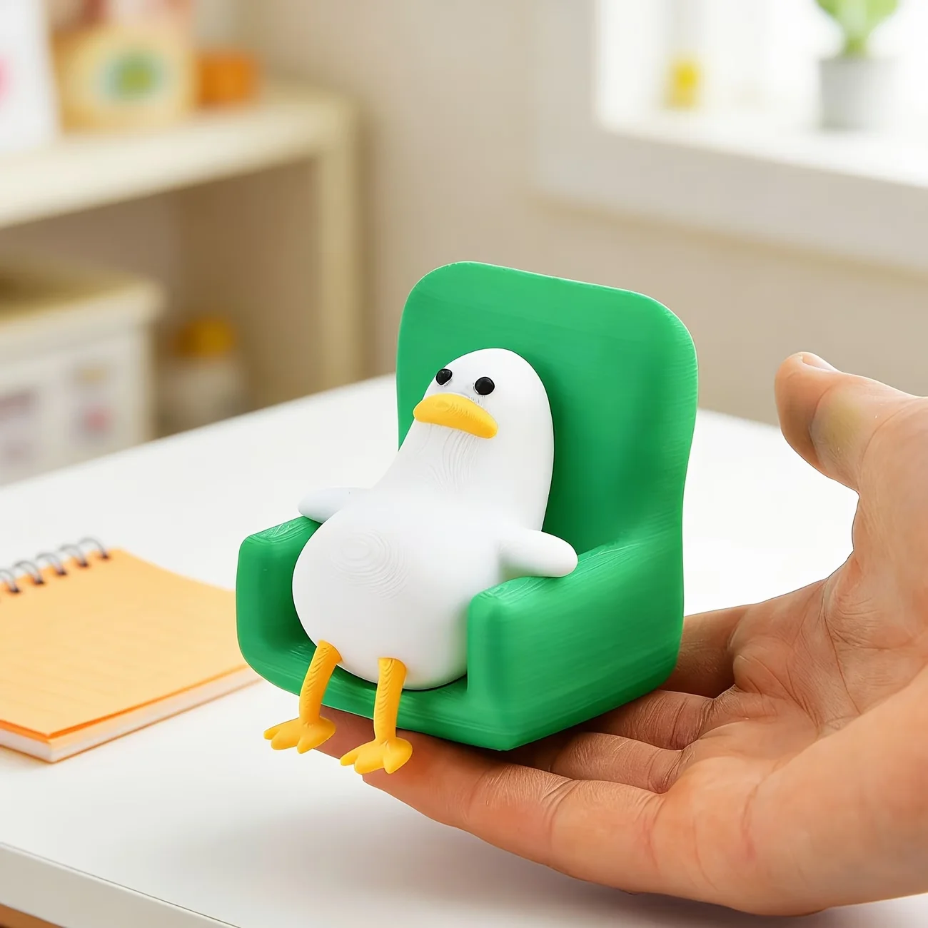 A lying duck with a funny and cute expression, a small office desk decoration, creative animal shape. view 3