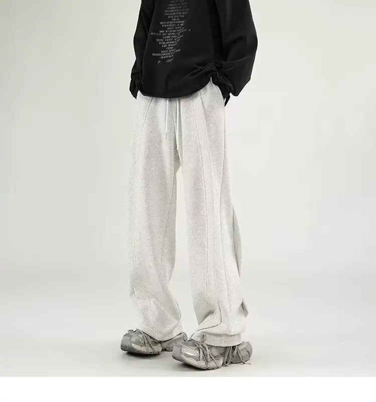 Pantaloni della tuta a gamba larga coreani uomo pantaloni larghi Casual tinta unita maschili Streetwear vestiti 2024 primavera autunno moda pantaloni della tuta da uomo