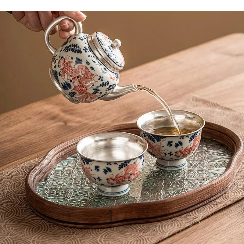 

Позолоченный серебряный керамический чайный сервиз Золотая рыбка Чайник с фильтром Один горшок Два чашки Стеклянный поднос Посуда для приготовления кунг-фу