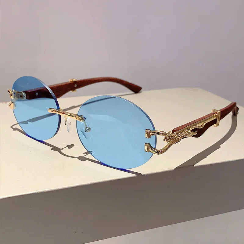 

Luxury Brand Designer Vintage Rimless Oval Sunglasses Women For Men Sun Glasses Trendy Punk Popular Metal Leopard Eyeglasses